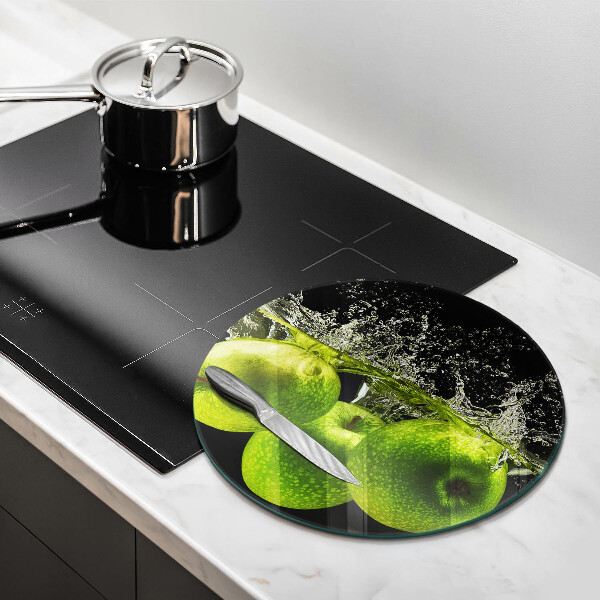 Chopping board glass Green apples and water