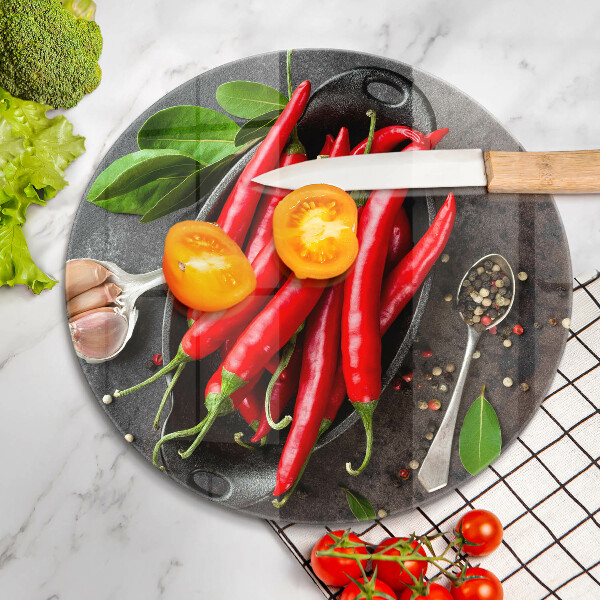 Chopping board glass Red chili peppers