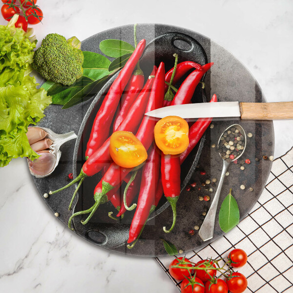 Chopping board glass Red chili peppers