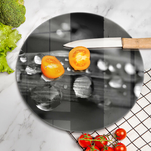 Chopping board glass Drops of dew on the leaves