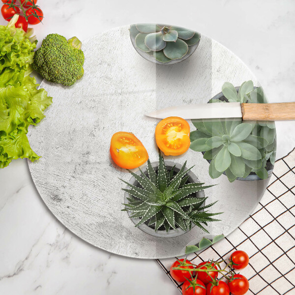 Chopping board glass Succulents on concrete