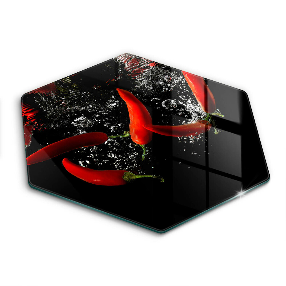 Chopping board glass Chili peppers in water