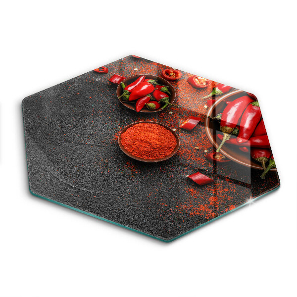 Glass chopping board Red chili peppers