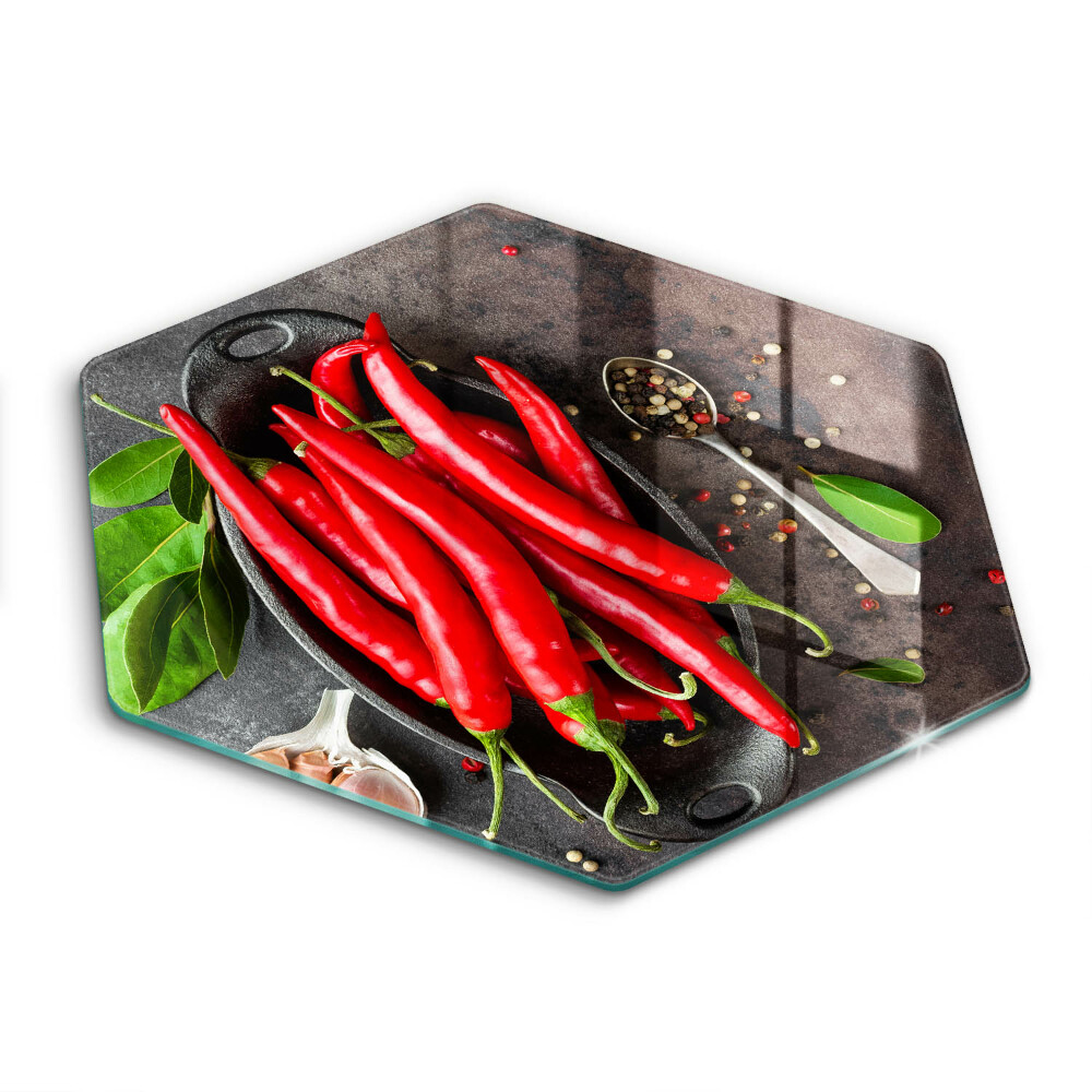 Chopping board glass Red chili peppers