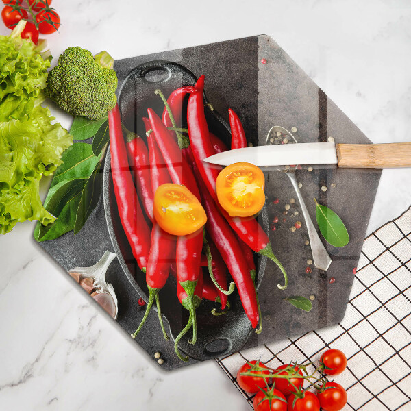 Chopping board glass Red chili peppers