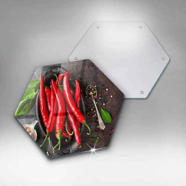 Chopping board glass Red chili peppers