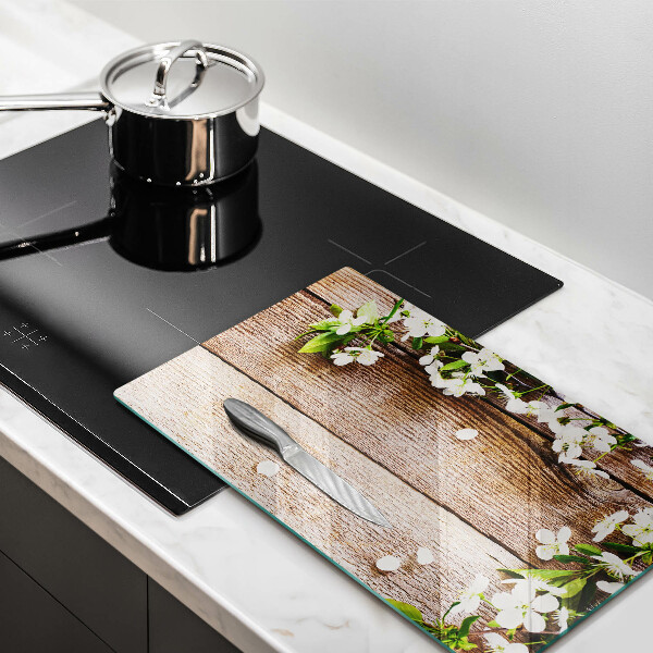 Induction hob protector White flowers on the boards