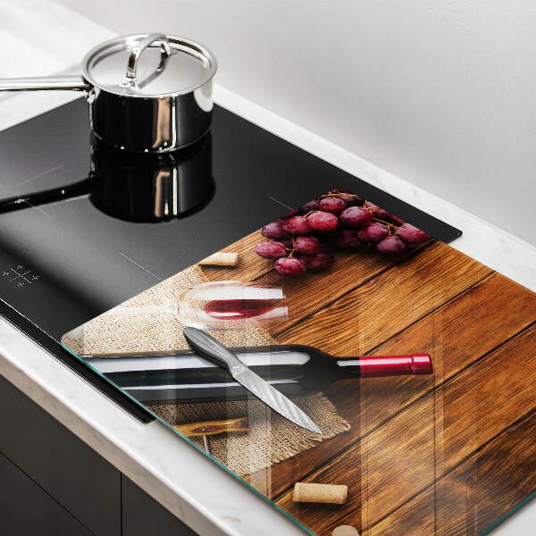 Glass kitchen board A bottle of red wine