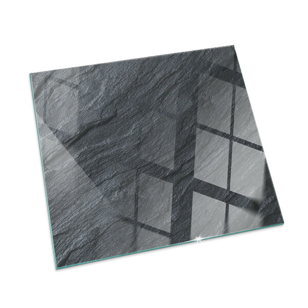 Square glass hearth for log burner Stone surface texture