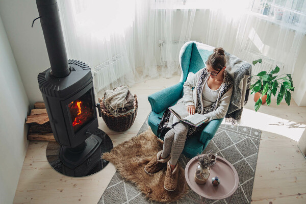 Round glass wood burner hearth Natural stone texture