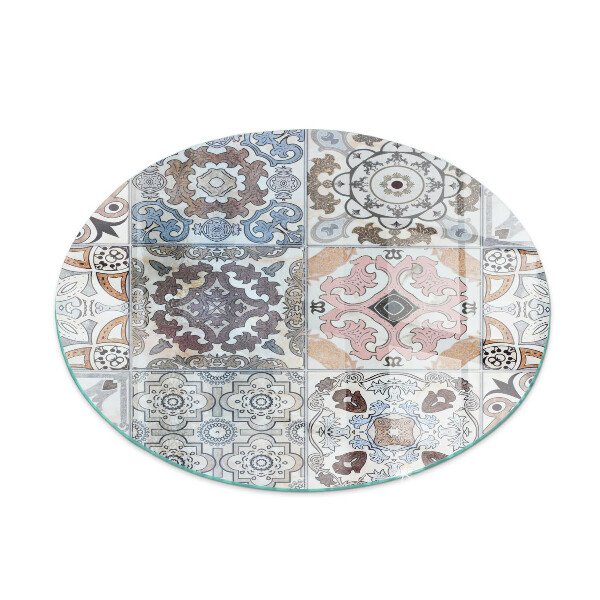 Round glass wood burner hearth Mosaic patterns in tiles