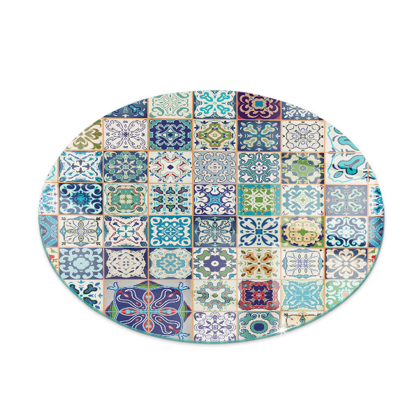 Round glass fire hearth Mosaic patterns on tiles