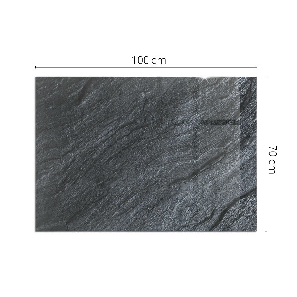 Rectangular glass hearth for log burner Stone surface texture