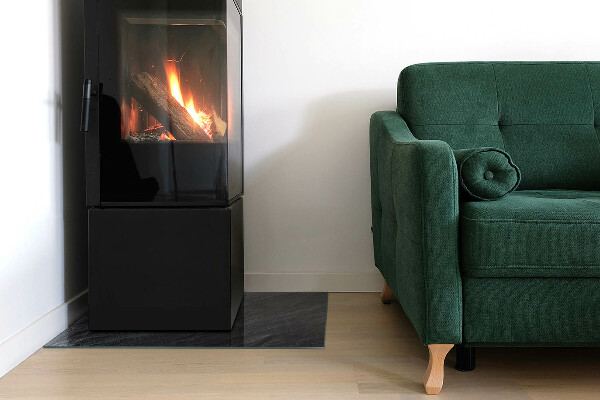 Rectangular glass hearth for log burner Stone surface texture