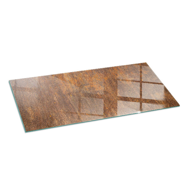 Rectangular glass hearth for log burner Rust texture on the background
