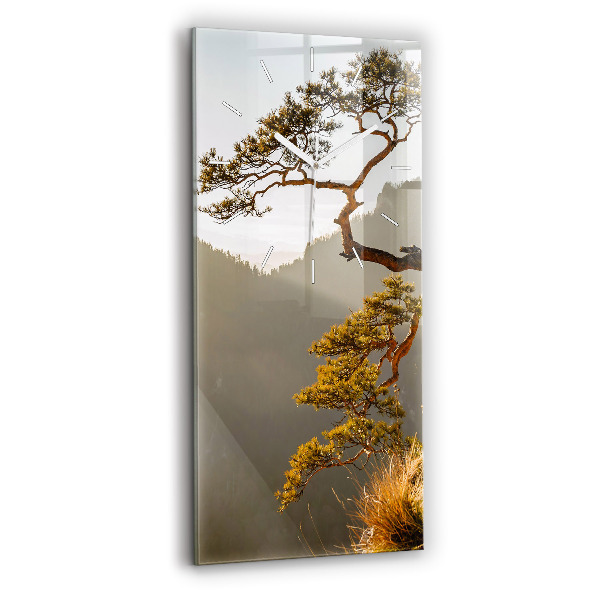 Vertical wall clock A tree in the mountains