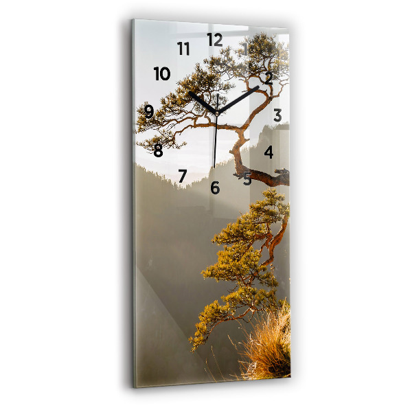 Vertical wall clock A tree in the mountains