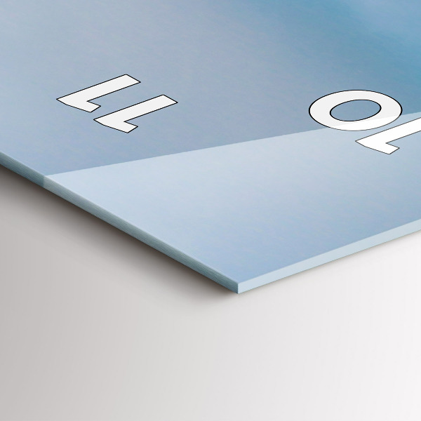 Vertical wall clock Giraffe head against the sky