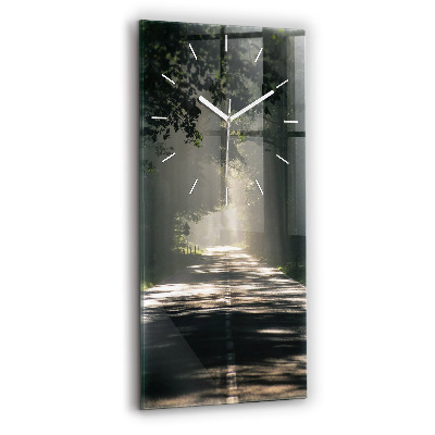 Vertical wall clock Forest road and streaks of sunlight