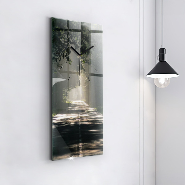 Vertical wall clock Forest road and streaks of sunlight