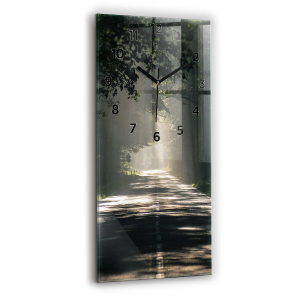 Vertical wall clock Forest road and streaks of sunlight