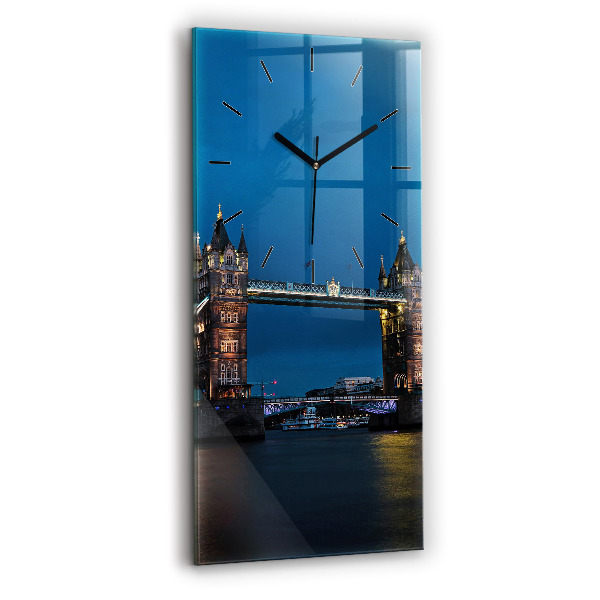 Vertical wall clock Tower Bridge London at night