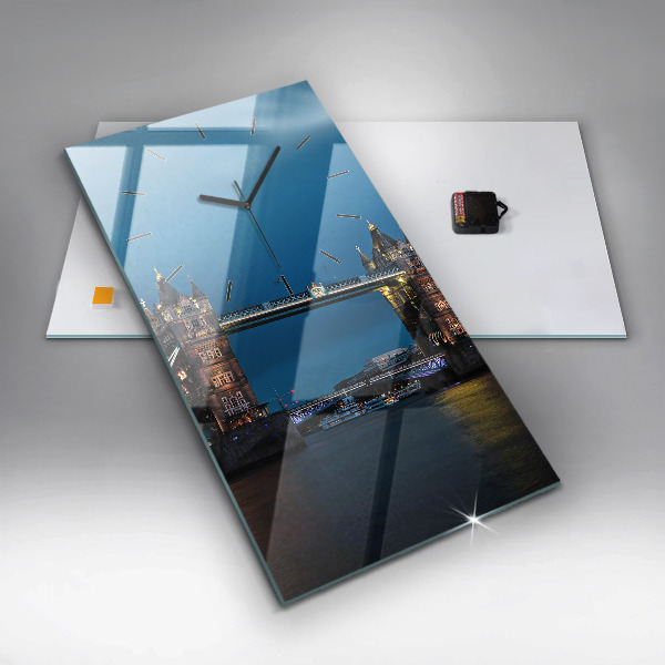 Vertical wall clock Tower Bridge London at night