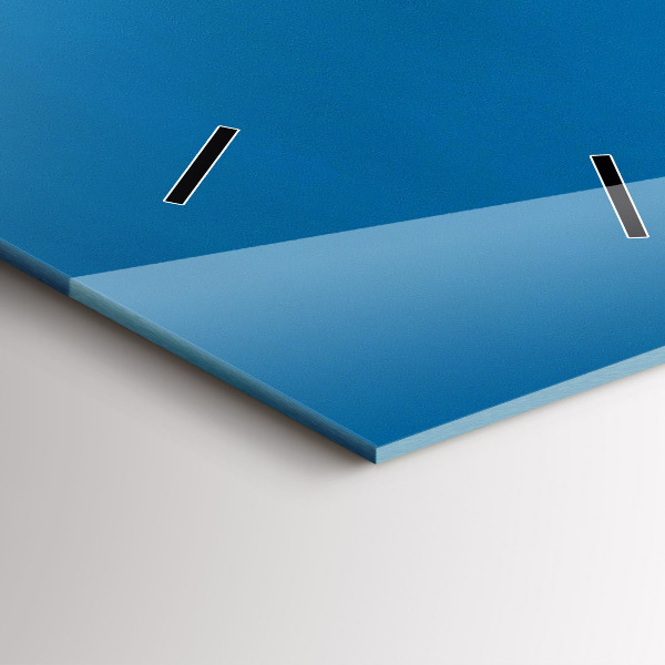 Vertical wall clock Tower Bridge London at night