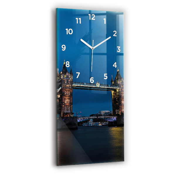 Vertical wall clock Tower Bridge London at night