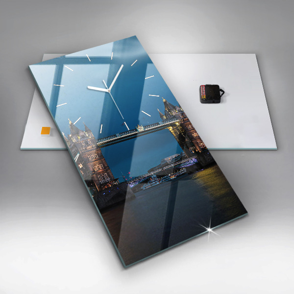 Vertical wall clock Tower Bridge London at night