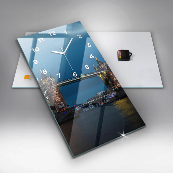 Vertical wall clock Tower Bridge London at night