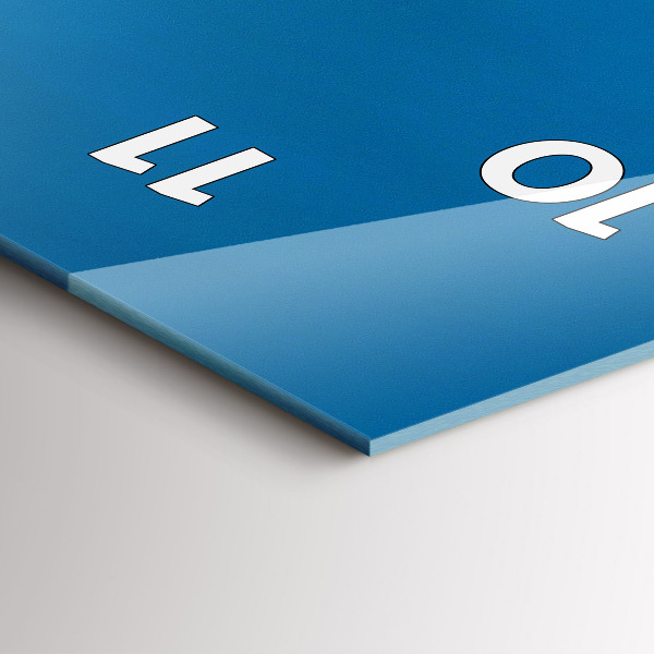 Vertical wall clock Tower Bridge London at night