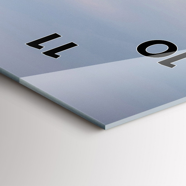 Vertical wall clock A mountain covered in snow