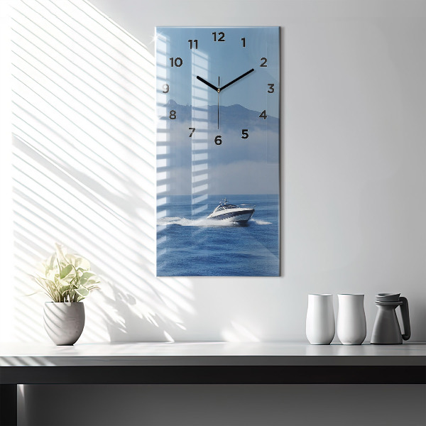 Vertical wall clock A boat floating on the ocean