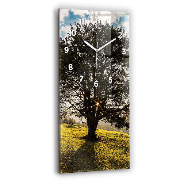 Vertical wall clock A tree on a hill
