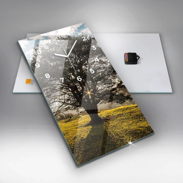 Vertical wall clock A tree on a hill