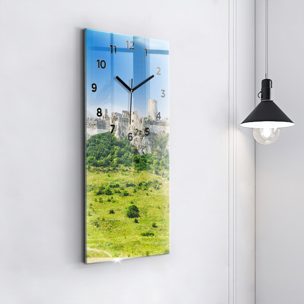 Vertical wall clock Spiš Castle in Slovakia