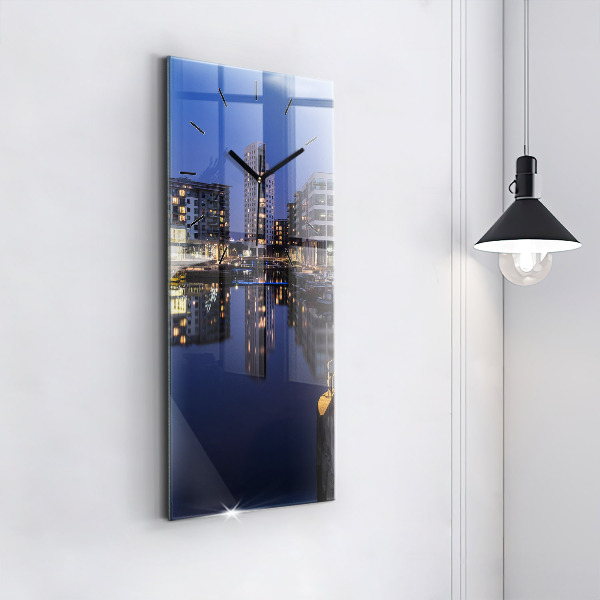 Vertical wall clock The city lit up at night