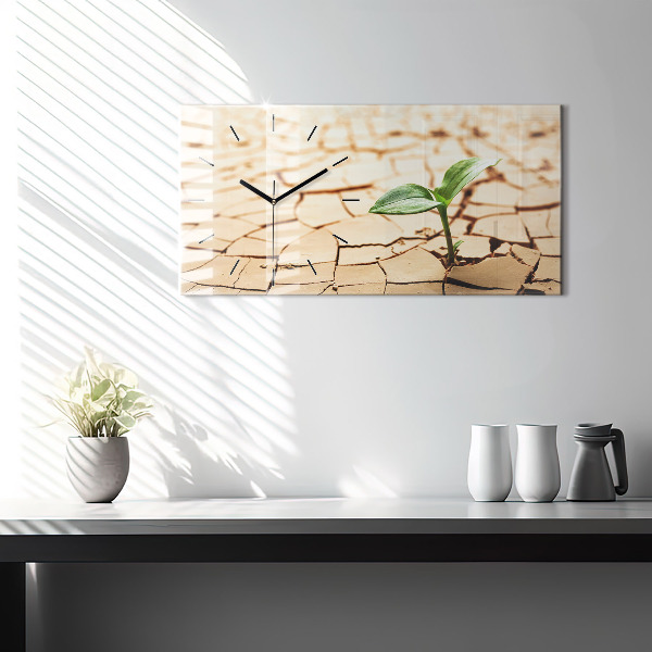Horizontal wall clock A plant in dried-out soil