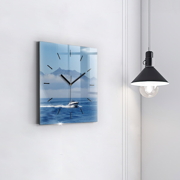 Square wall clock A boat floating on the ocean