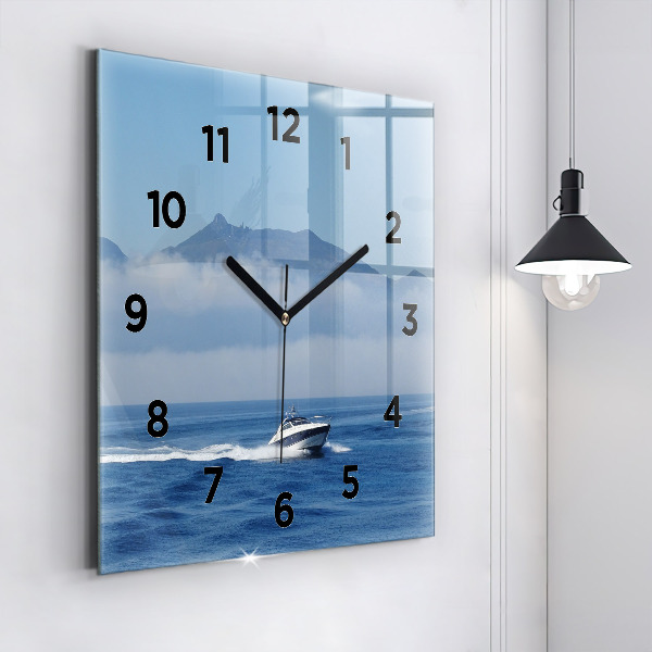 Square wall clock A boat floating on the ocean