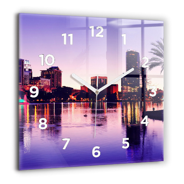 Square wall clock Evening panorama of the city