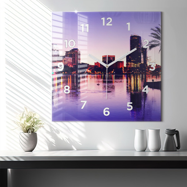 Square wall clock Evening panorama of the city
