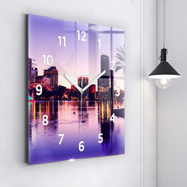 Square wall clock Evening panorama of the city