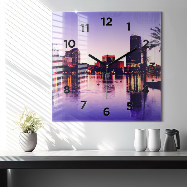 Square wall clock Evening panorama of the city