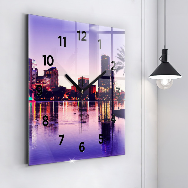 Square wall clock Evening panorama of the city