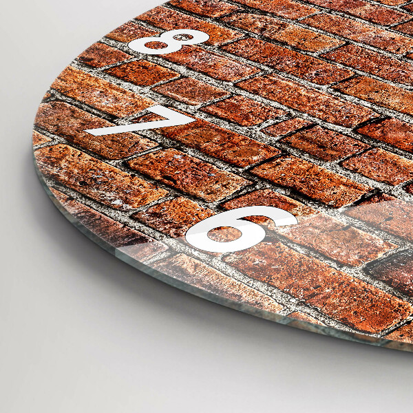 Round glass wall clock Old brick wall