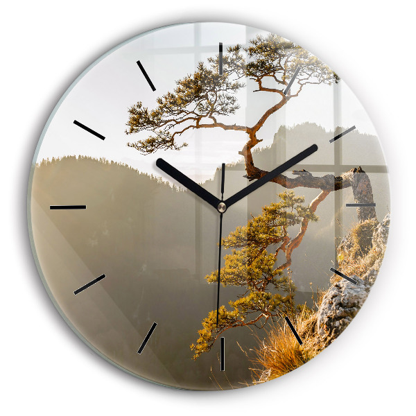 Round glass wall clock A tree in the mountains
