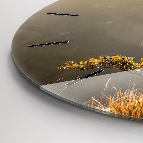 Round glass wall clock A tree in the mountains