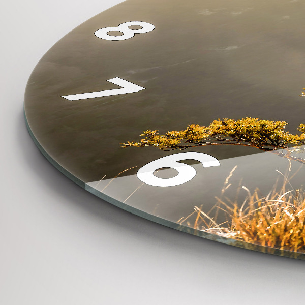 Round glass wall clock A tree in the mountains